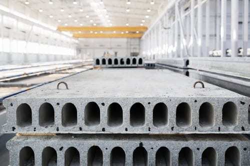 Stack of precast reinforced concrete slabs in a warehouse